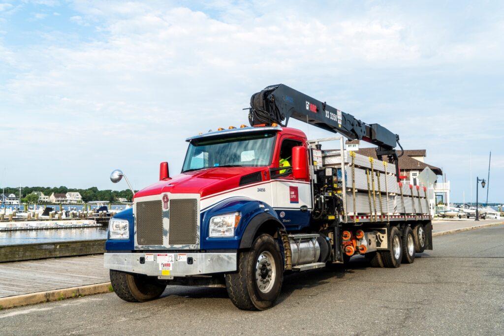 L&W Supply Truck Making A Delivery Near A Lake