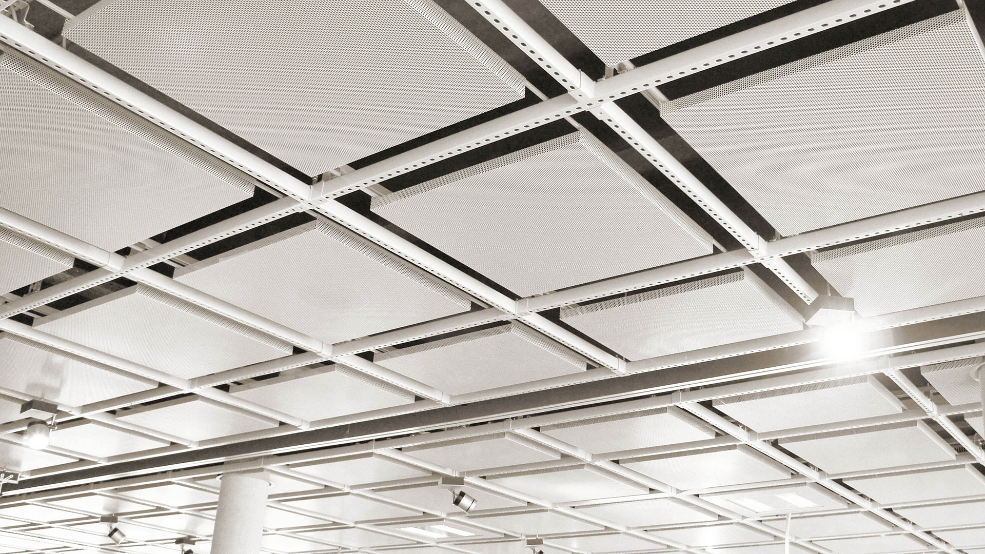 An acoustical drop ceiling in a grid pattern.