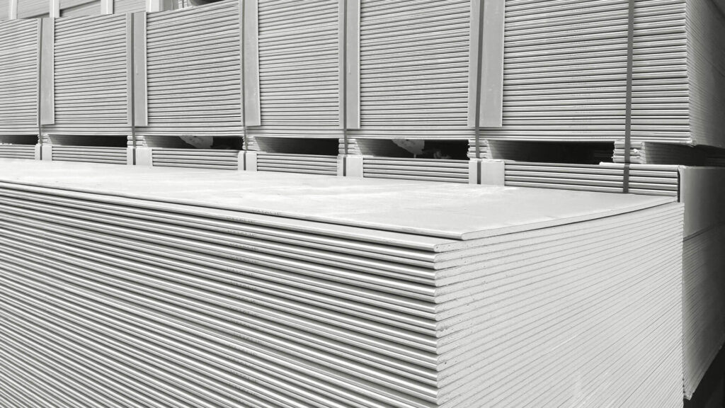 Multiple stacks of drywall.