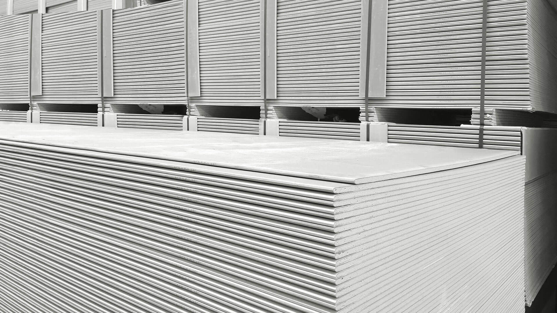 Multiple stacks of drywall.